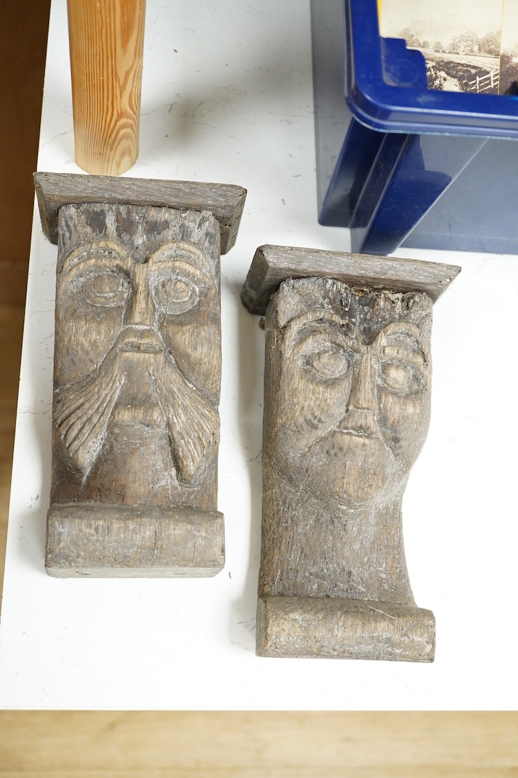 Two African carved wood ancestor figures, tallest 171cm, with two European carved mask capitals